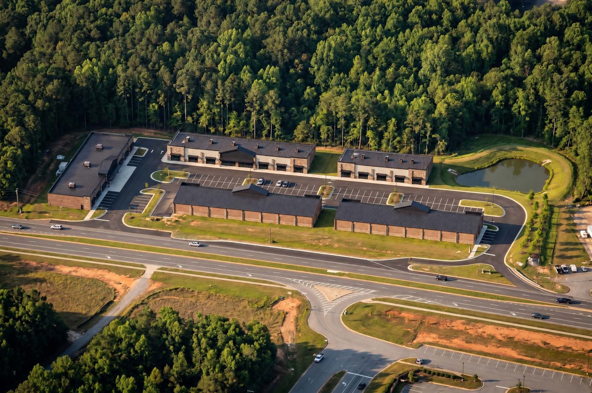 Hull Row full-site aerial rendering — five storefront buildings off Hull Road